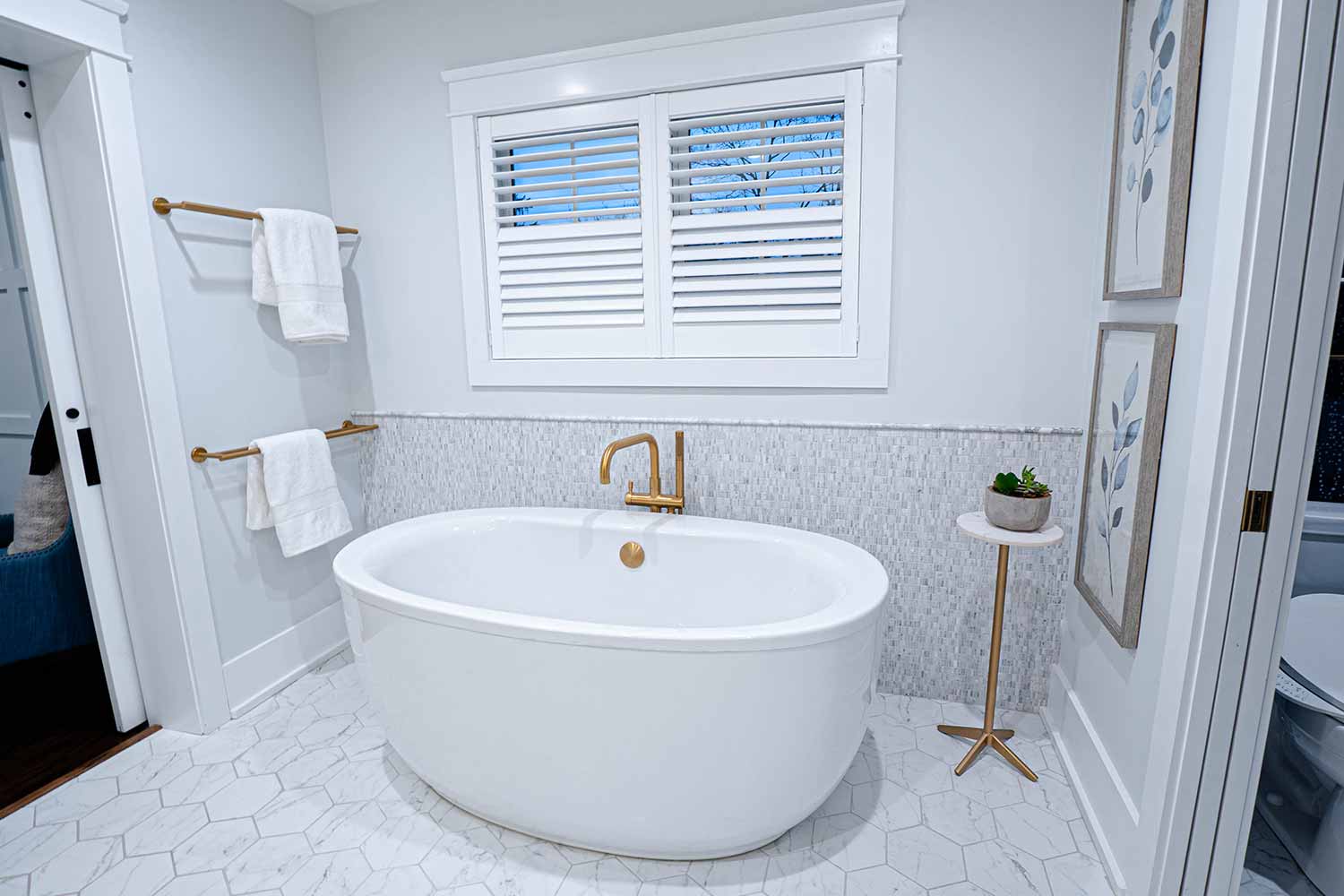 White and airy bathroom remodel with soaker tub.
